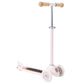 Pink scooter with wooden handlebar and deck on a white background