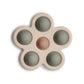 Mushie Silicone Baby Sensory Flower Pop Toy - Thyme/Natural/Shifting Sand